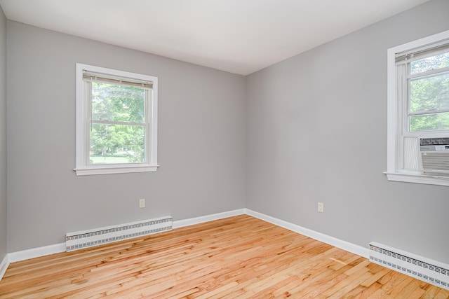15 Sky Edge Ln, Bethel, CT 06801 - spare room with a baseboard radiator and wood finished floors