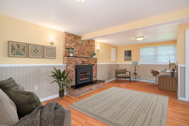 15 Sky Edge Ln, Bethel, CT 06801 - living area featuring wainscoting, wood finished floors, a fireplace, beam ceiling, and baseboard heating
