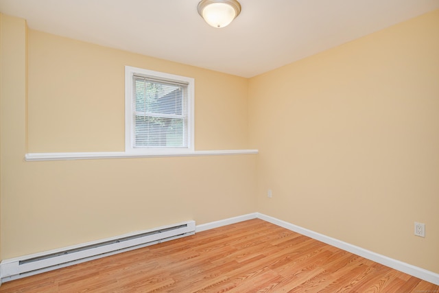 15 Sky Edge Ln, Bethel, CT 06801 - empty room with a baseboard heating unit and light wood-type flooring