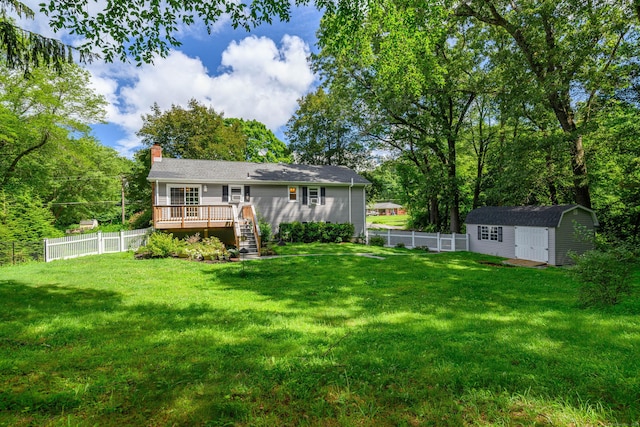 15 Sky Edge Ln, Bethel, CT 06801 - rear view of property with a wooden deck, a fenced backyard, a storage unit, a chimney, and stairs