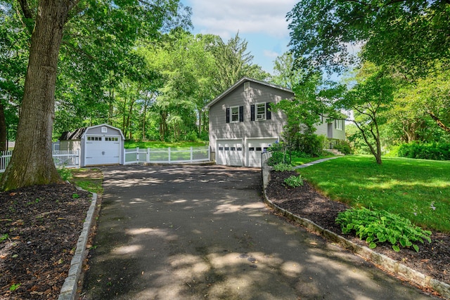 15 Sky Edge Ln, Bethel, CT 06801 - view of property exterior featuring driveway, a detached garage, and an outdoor structure