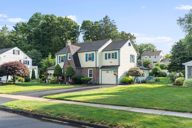 35 Grandview Ter, Wethersfield, CT 06109 - view of front of property with driveway, an attached garage, a front lawn, a chimney, and brick siding