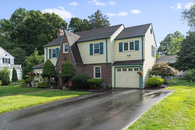 35 Grandview Ter, Wethersfield, CT 06109 - view of front of property with driveway, a chimney, roof with shingles, a garage, and brick siding