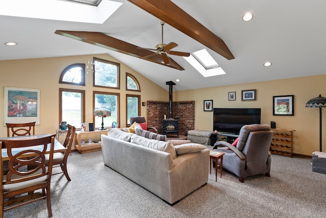 35 Grandview Ter, Wethersfield, CT 06109 - living area with a skylight, a wood stove, light colored carpet, ceiling fan, and recessed lighting