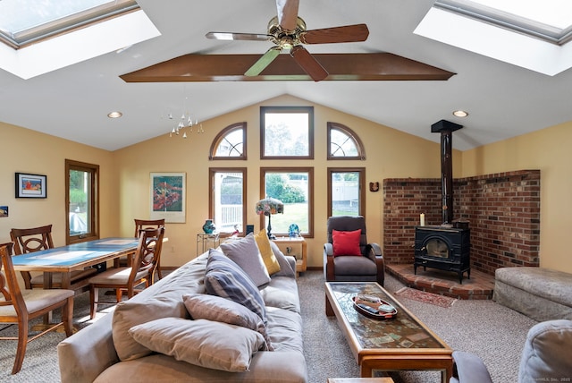 35 Grandview Ter, Wethersfield, CT 06109 - living room featuring a skylight, a wood stove, carpet floors, a ceiling fan, and lofted ceiling