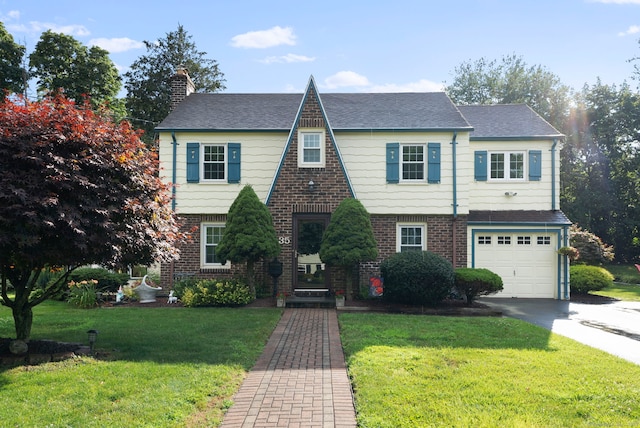 35 Grandview Ter, Wethersfield, CT 06109 - view of front of home with a chimney, concrete driveway, brick siding, and a front yard