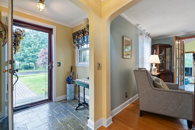 35 Grandview Ter, Wethersfield, CT 06109 - entrance foyer with crown molding, plenty of natural light, arched walkways, and a textured ceiling