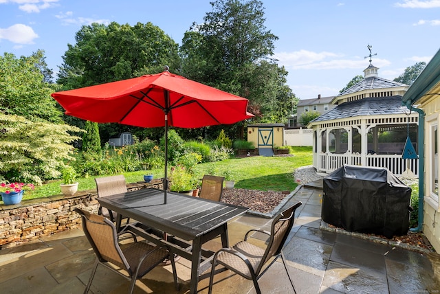 35 Grandview Ter, Wethersfield, CT 06109 - view of patio with outdoor dining area, a storage unit, a gazebo, and a grill