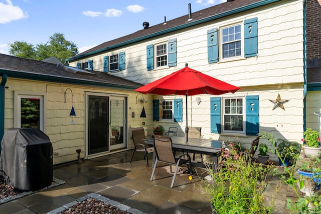 35 Grandview Ter, Wethersfield, CT 06109 - rear view of house with a patio and outdoor dining area