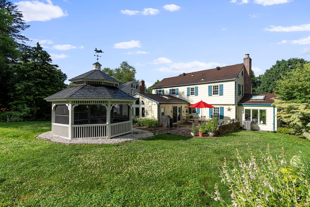 35 Grandview Ter, Wethersfield, CT 06109 - rear view of property featuring a patio, a gazebo, a chimney, and a yard