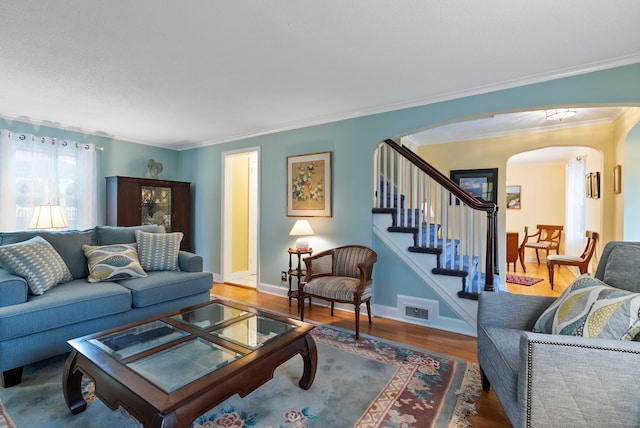 35 Grandview Ter, Wethersfield, CT 06109 - living area with arched walkways, wood finished floors, crown molding, and stairway