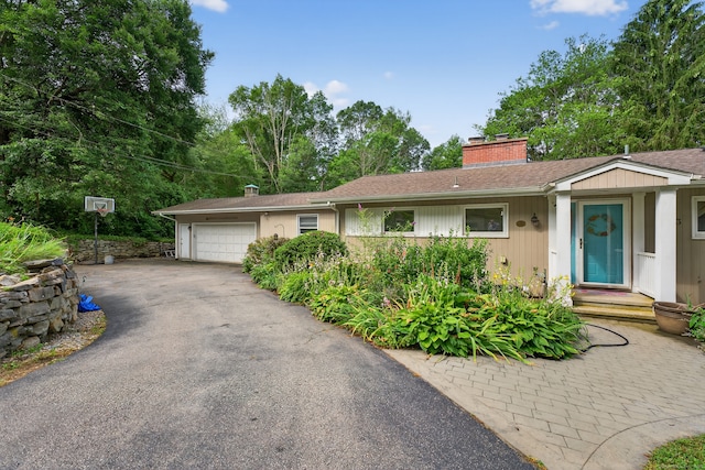 3 Laurel Hill Dr S, East Lyme, CT 06357 - ranch-style home with a garage, a chimney, and asphalt driveway