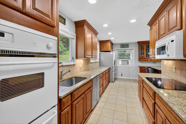 3 Laurel Hill Dr S, East Lyme, CT 06357 - kitchen featuring stainless steel appliances, backsplash, brown cabinets, and recessed lighting