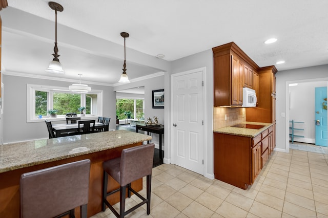 3 Laurel Hill Dr S, East Lyme, CT 06357 - kitchen with white microwave, plenty of natural light, backsplash, light tile patterned floors, and recessed lighting
