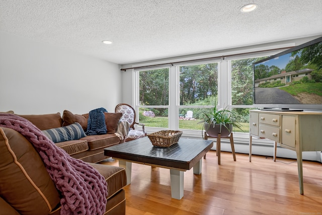 3 Laurel Hill Dr S, East Lyme, CT 06357 - living area with a textured ceiling, light wood-style floors, a baseboard heating unit, and recessed lighting