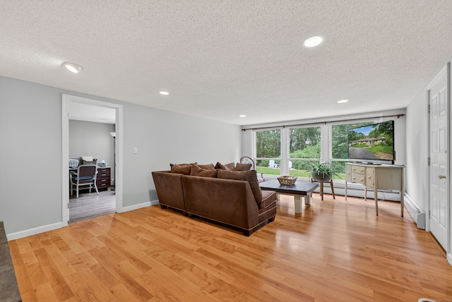 3 Laurel Hill Dr S, East Lyme, CT 06357 - living area featuring light wood finished floors, a textured ceiling, recessed lighting, a desk, and baseboard heating