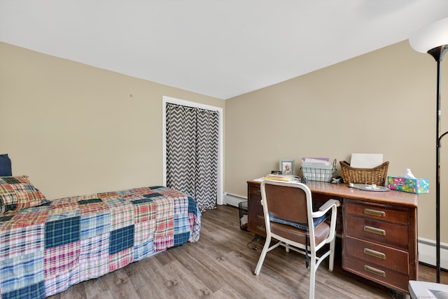 3 Laurel Hill Dr S, East Lyme, CT 06357 - bedroom with a baseboard heating unit, light wood-style flooring, and baseboard heating