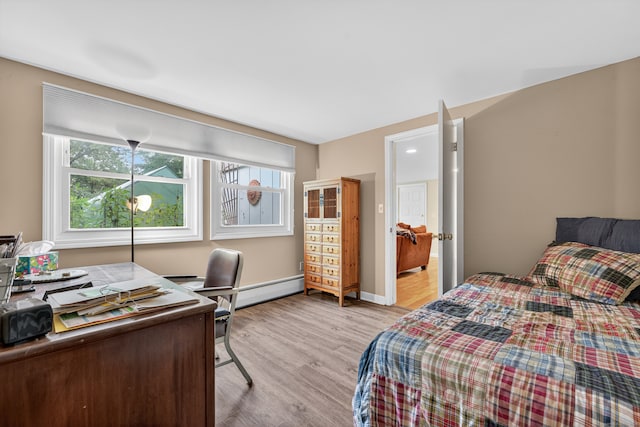 3 Laurel Hill Dr S, East Lyme, CT 06357 - bedroom featuring light wood-style flooring, an office area, and a baseboard radiator