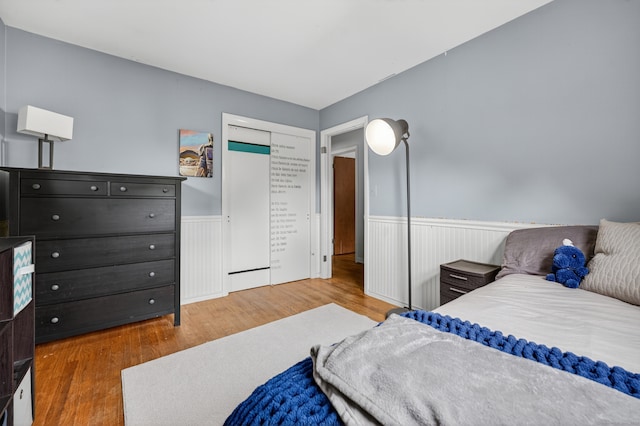 3 Laurel Hill Dr S, East Lyme, CT 06357 - bedroom with wainscoting, wood finished floors, and a closet