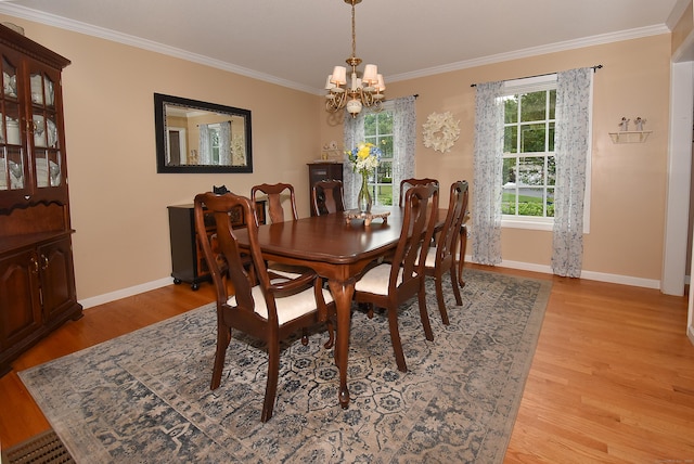 55 Hydrangea Ln, Suffield, CT 06078 - dining space with a chandelier, crown molding, and light wood-style floors