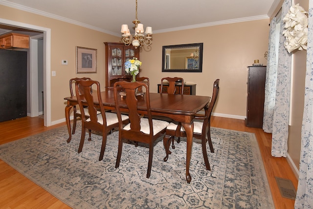 55 Hydrangea Ln, Suffield, CT 06078 - dining area with a chandelier, wood finished floors, and ornamental molding