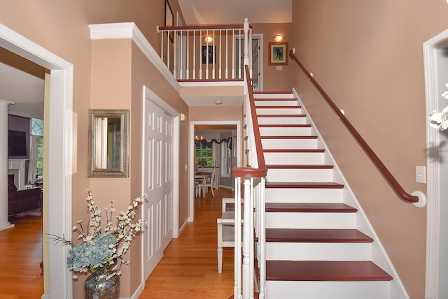 55 Hydrangea Ln, Suffield, CT 06078 - stairs with wood finished floors and a towering ceiling