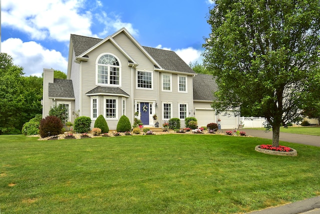 55 Hydrangea Ln, Suffield, CT 06078 - colonial-style house with a shingled roof, an attached garage, a front yard, and a chimney