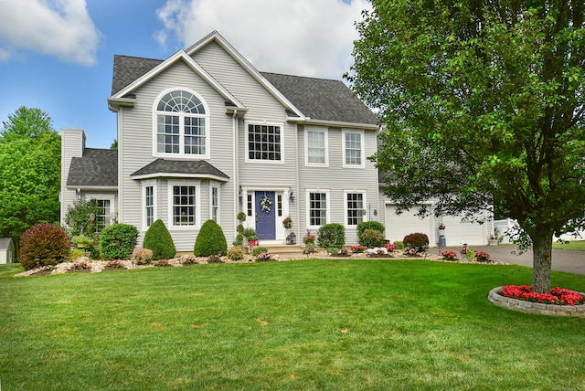 55 Hydrangea Ln, Suffield, CT 06078 - colonial-style house with a shingled roof, driveway, and a front lawn