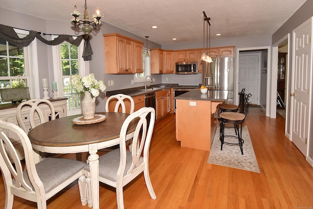 55 Hydrangea Ln, Suffield, CT 06078 - dining area with light wood-style flooring, recessed lighting, and a chandelier