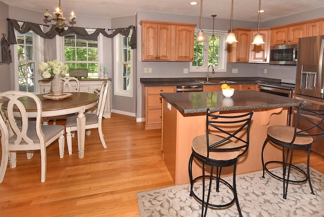 55 Hydrangea Ln, Suffield, CT 06078 - kitchen with appliances with stainless steel finishes, light wood-type flooring, a chandelier, a center island, and recessed lighting