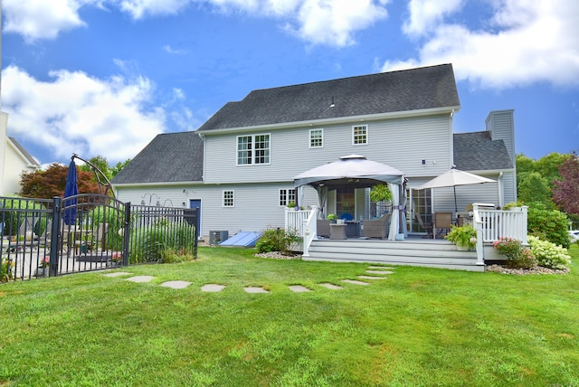 55 Hydrangea Ln, Suffield, CT 06078 - rear view of house featuring a gazebo, a wooden deck, roof with shingles, and a chimney
