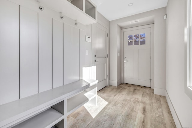 888 Oldfield Rd, Fairfield, CT 06824 - mudroom featuring light wood-style floors and baseboards