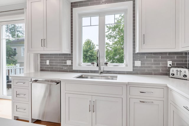 888 Oldfield Rd, Fairfield, CT 06824 - kitchen with dishwasher, healthy amount of natural light, and tasteful backsplash