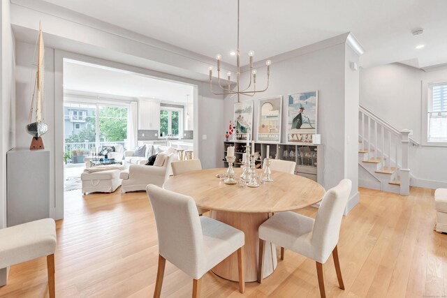 888 Oldfield Rd, Fairfield, CT 06824 - dining area featuring stairs, plenty of natural light, light wood-type flooring, recessed lighting, and a chandelier