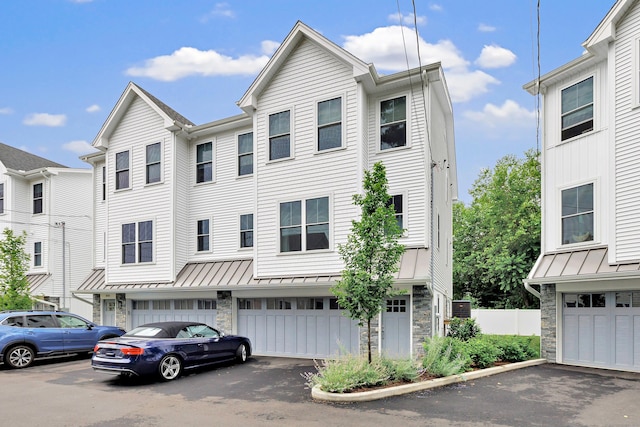 888 Oldfield Rd, Fairfield, CT 06824 - traditional home featuring a standing seam roof, stone siding, and a metal roof