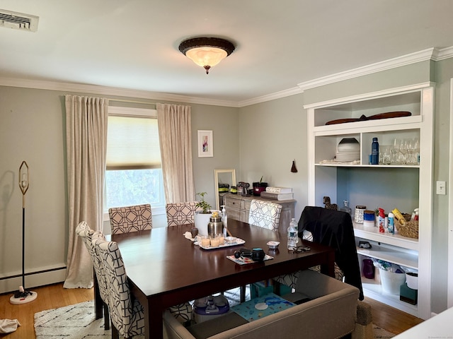 271 Jeniford Rd, Fairfield, CT 06824 - dining room featuring a baseboard heating unit, ornamental molding, and wood finished floors