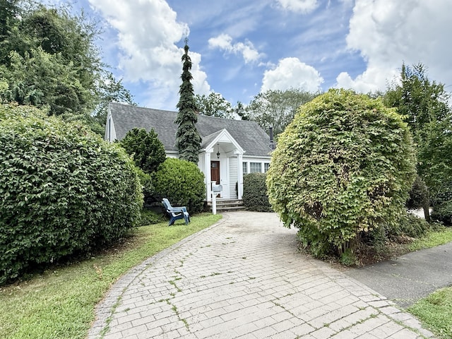 271 Jeniford Rd, Fairfield, CT 06824 - view of front of house featuring decorative driveway and roof with shingles