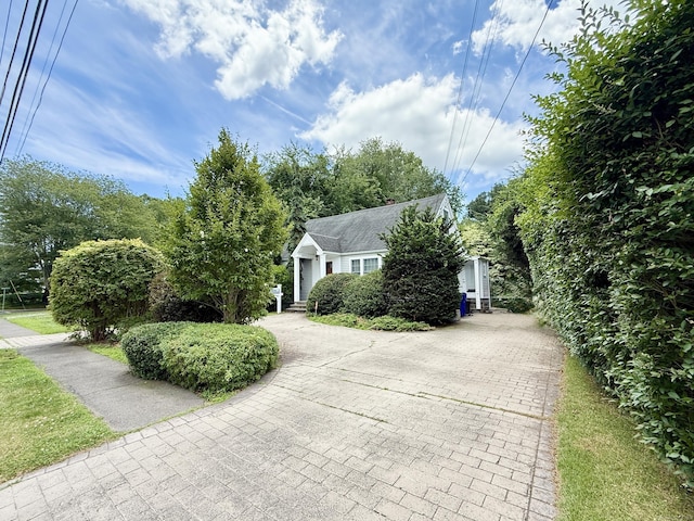 271 Jeniford Rd, Fairfield, CT 06824 - view of property hidden behind natural elements featuring decorative driveway