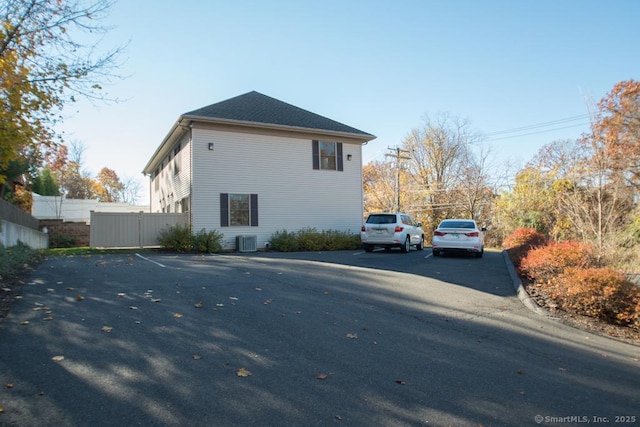 783 Naugatuck Ave, Milford, CT 06461 - view of side of home featuring uncovered parking and a central air condition unit
