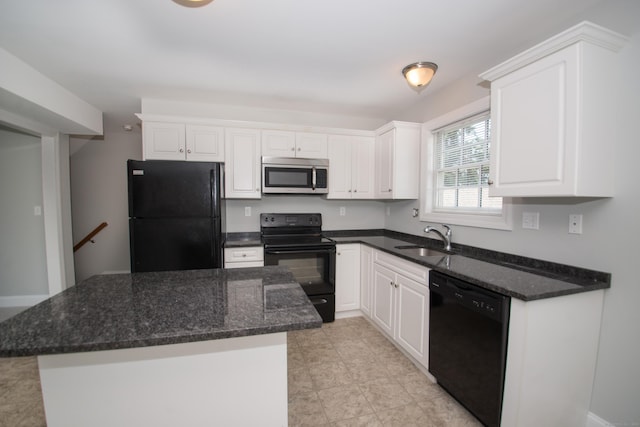 783 Naugatuck Ave, Milford, CT 06461 - kitchen with black appliances, white cabinetry, a kitchen island, and dark stone counters