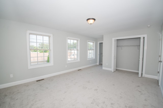 783 Naugatuck Ave, Milford, CT 06461 - unfurnished bedroom with light carpet and a closet
