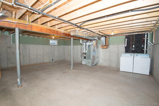 783 Naugatuck Ave, Milford, CT 06461 - unfinished basement featuring separate washer and dryer, heating unit, and electric panel