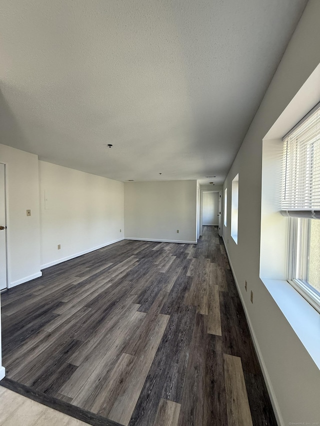 449 Judd Sq Unit 449, Wallingford, CT 06492 - unfurnished living room with dark wood finished floors and a textured ceiling