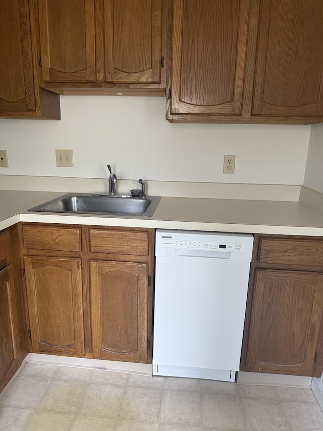 449 Judd Sq Unit 449, Wallingford, CT 06492 - kitchen featuring dishwasher, light countertops, and brown cabinets