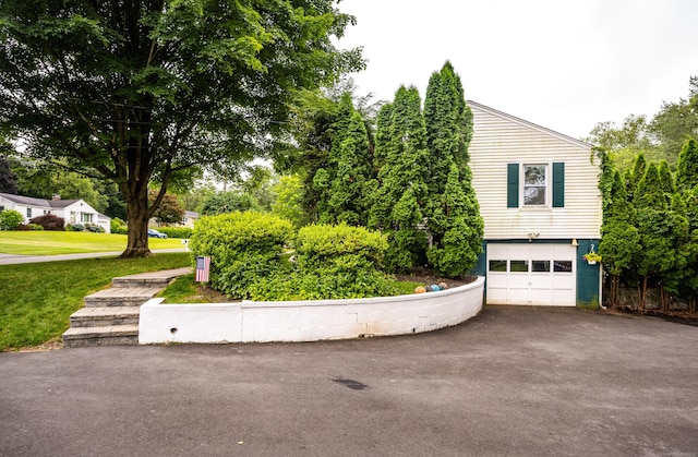 16 Westview Dr, Bethel, CT 06801 - view of home's exterior with driveway, a garage, and a lawn