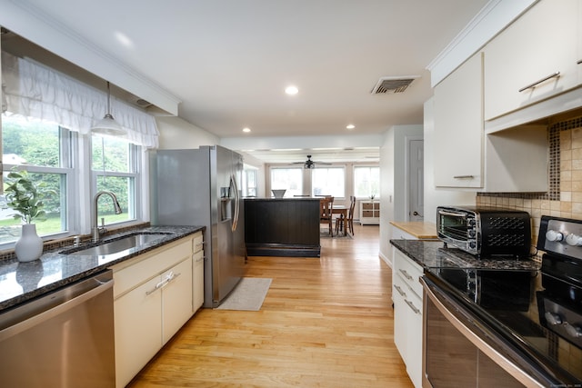 16 Westview Dr, Bethel, CT 06801 - kitchen featuring appliances with stainless steel finishes, light wood finished floors, plenty of natural light, decorative backsplash, and recessed lighting