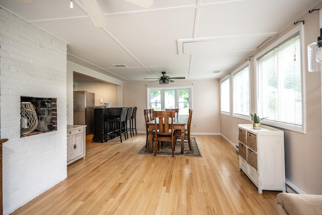 16 Westview Dr, Bethel, CT 06801 - dining room featuring light wood-type flooring, a ceiling fan, and a fireplace