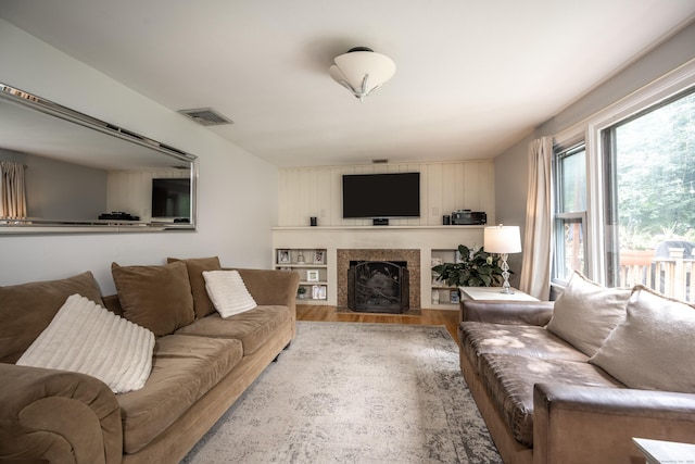 16 Westview Dr, Bethel, CT 06801 - living area featuring wood finished floors and a fireplace with flush hearth
