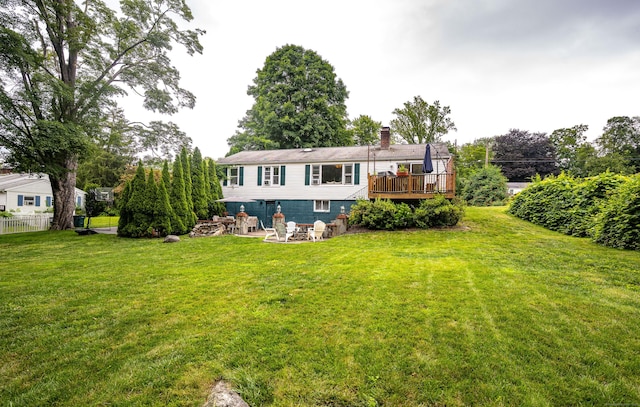 16 Westview Dr, Bethel, CT 06801 - back of property featuring a chimney, a lawn, a deck, and a patio