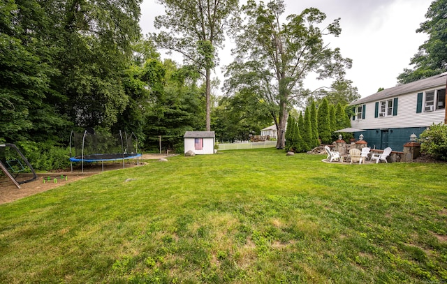 16 Westview Dr, Bethel, CT 06801 - view of yard with a trampoline, a storage unit, and view of scattered trees